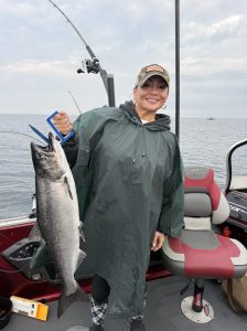 Customer holding a salmon they caught over Memorial day weekend out of Whitehall Michigan