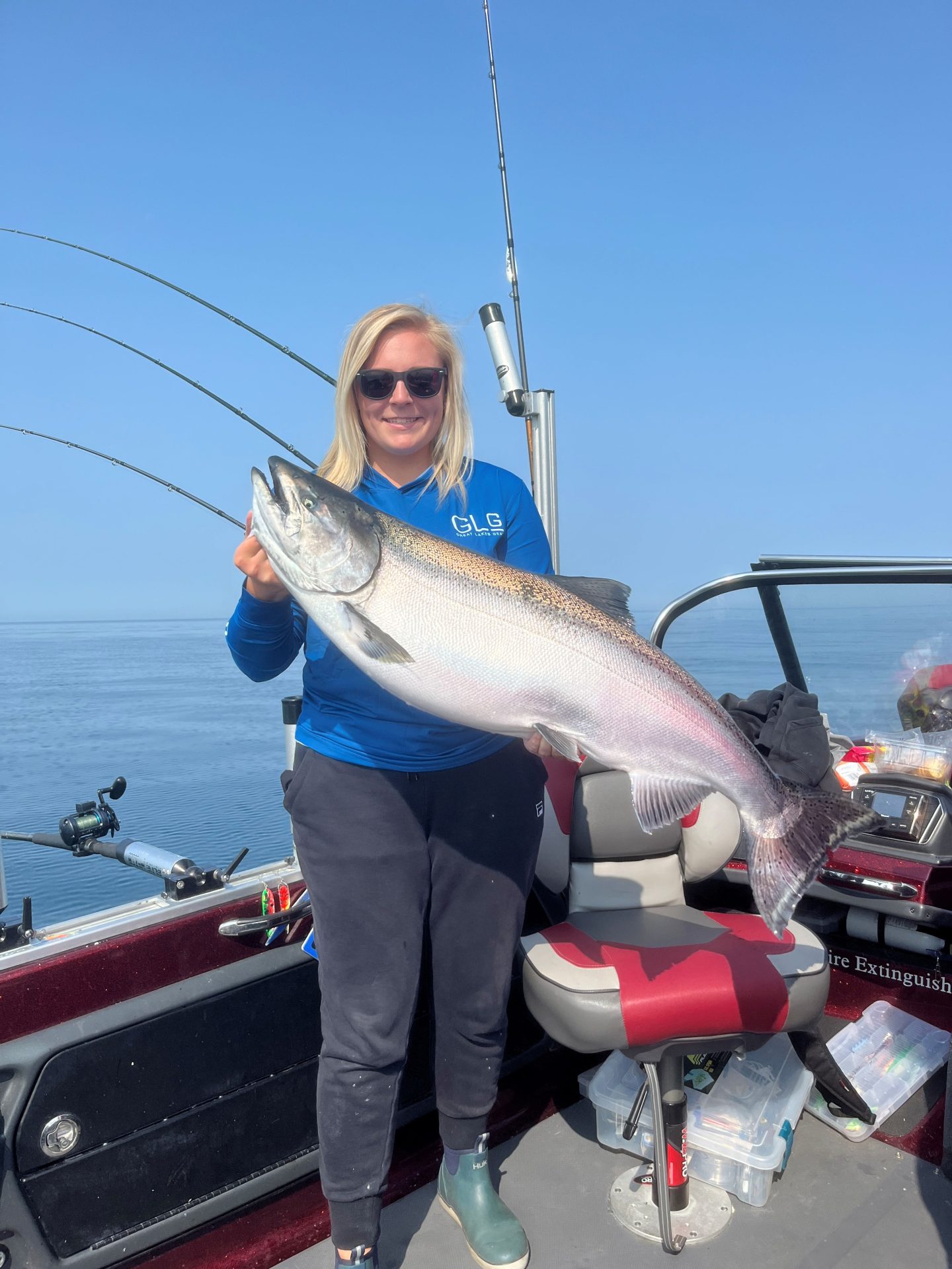 Woman catches Master Angler King Salmon out of Whitehall Michigan with Dave's Fishing Charters