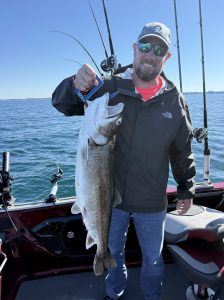 Customer with a Trophy Lake Trout caught out of Whitehall Michigan